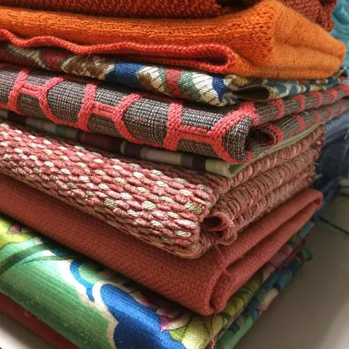 Rolls of donated patterned fabric stood on end