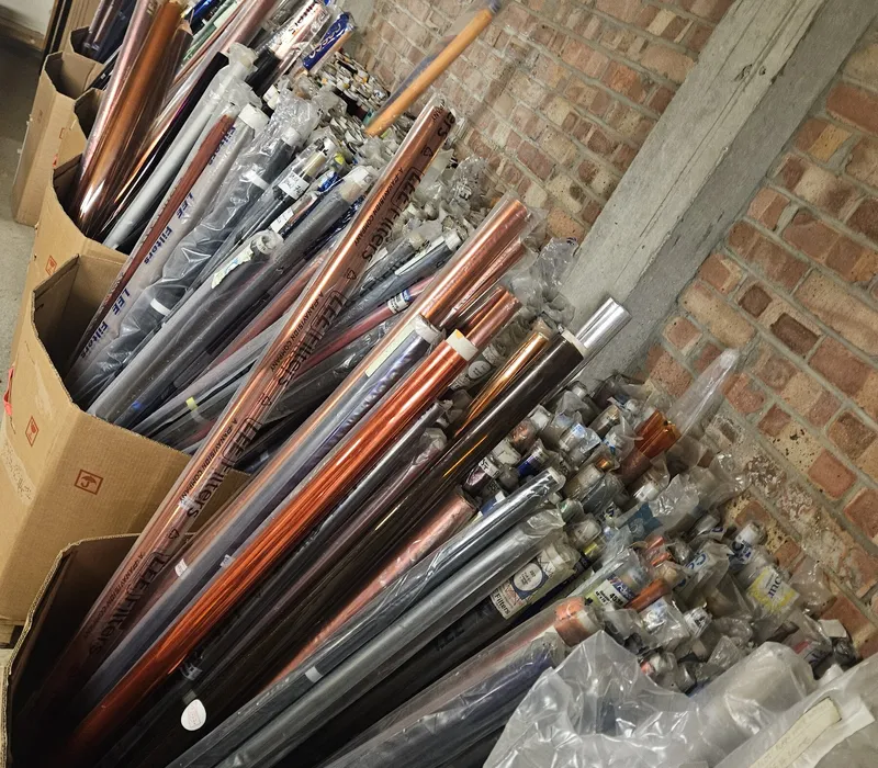Boxes of rescued fabric rolls and materials stored in the Scrapstore